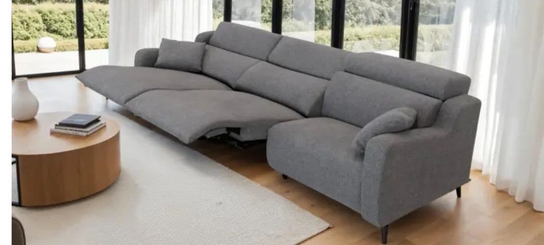 Modern grey sectional sofa from Fama, offering a sleek design and comfort.