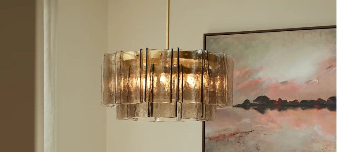 Heathfield amber glass panel chandelier with brass stem in a modern dining room