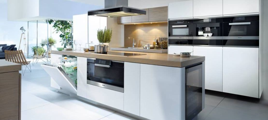 Miele built-in kitchen with ovens, coffee machine, dishwasher and wine cooler.