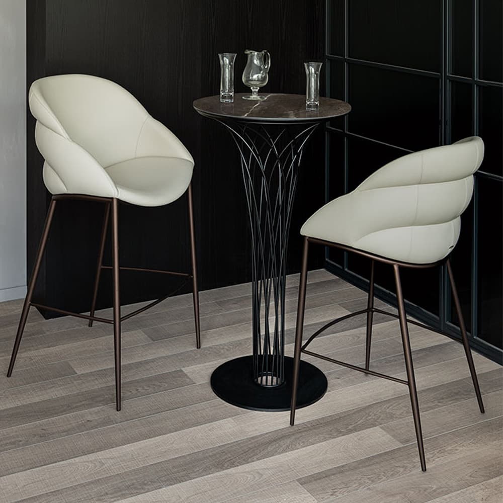 Side view of Camilla bar stool featuring horizontal stitching and ergonomic armrests