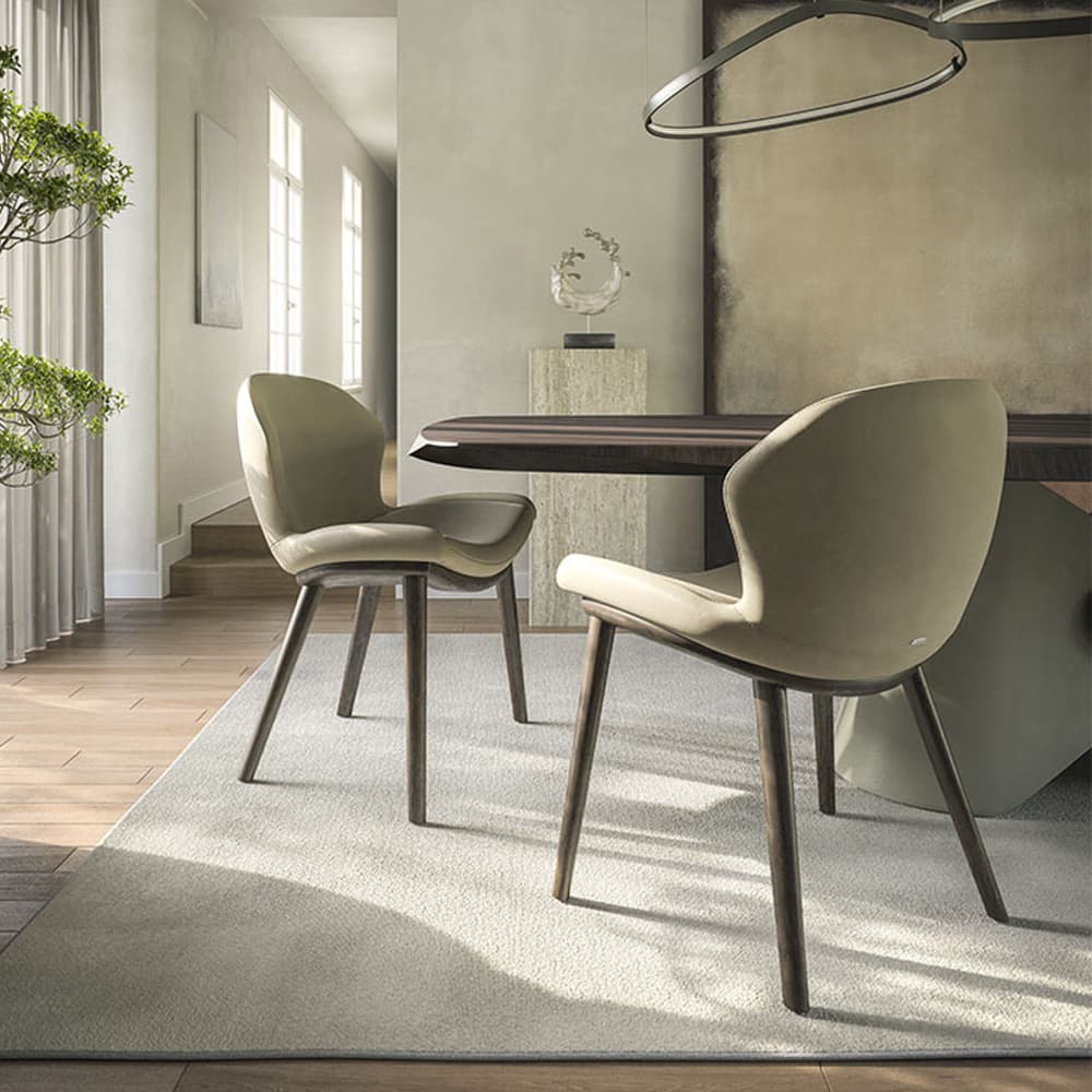 Side view of Rachel Wood dining chair showing curved backrest and wooden frame at FCI London