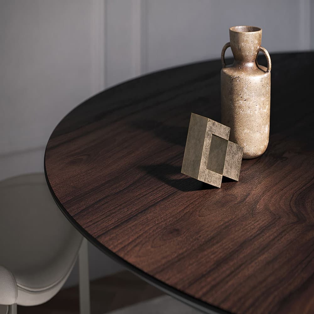 Elegant Senator dining table with a titanium steel base and walnut top from FCI London