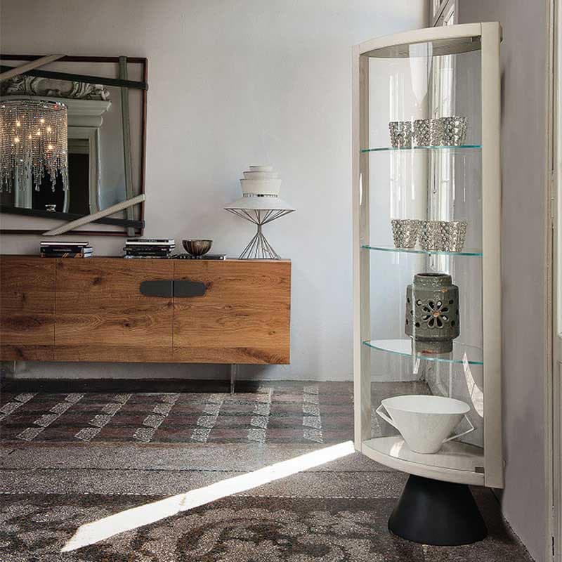 Elegant Saba display cabinet with wood and leather frame highlighted by sleek glass from FCI London