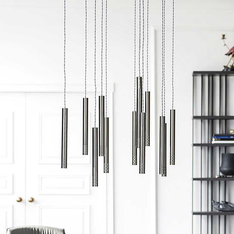 Stilo Ceiling Lamp with multiple shades elegantly suspended from steel plates, available at FCI London