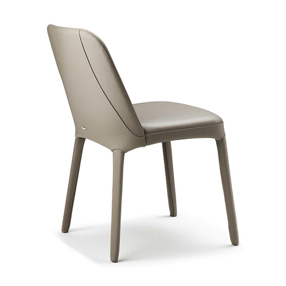 Elegant Wilma dining chair with soft upholstery and clean lines available at FCI London.
