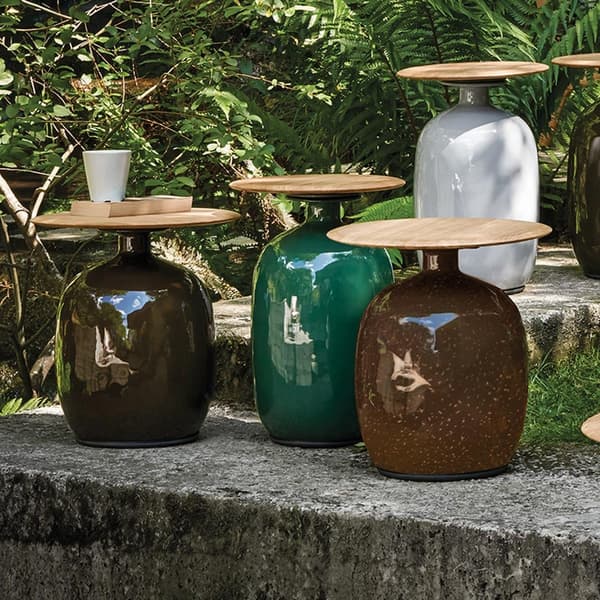 Blow low outdoor side table by Gloster with sculptural rounded silhouette