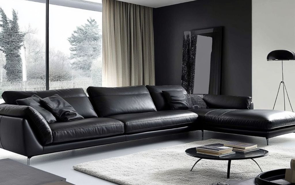 Black leather sectional sofa with clean lines and minimalist décor.