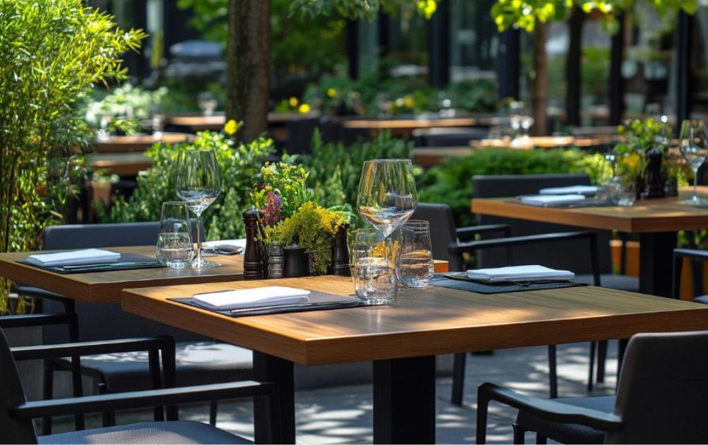 Extending outdoor dining table set in a garden