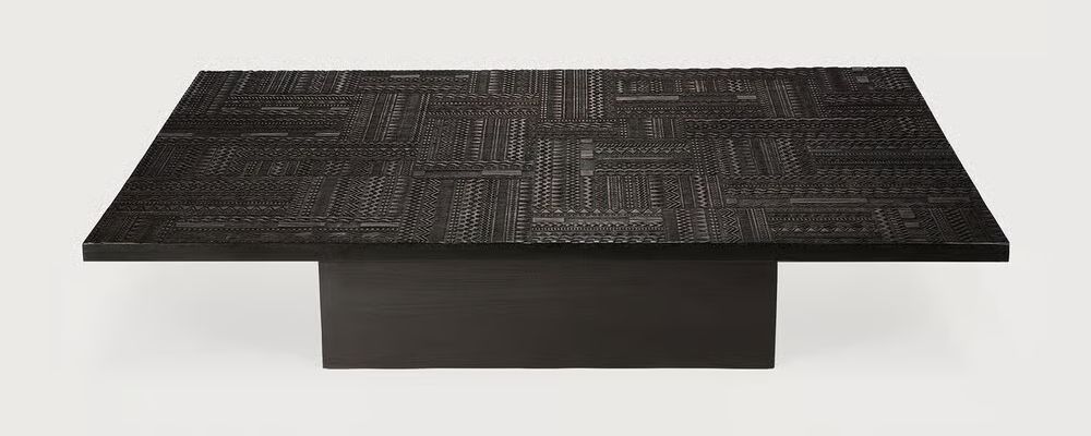 Tabwa Coffee Table by Ethnicraft showcasing sustainable black teak with hand-carved geometric patterns