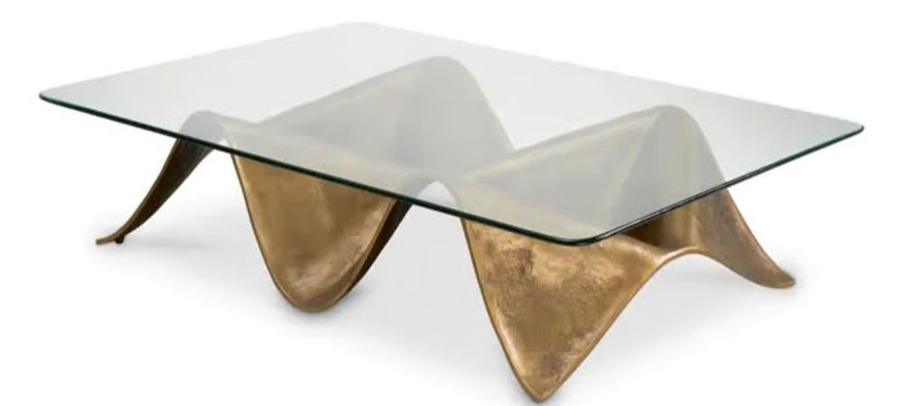 Angelico Coffee Table by Eichholtz with fluid wave-like base design and timeless classical proportions
