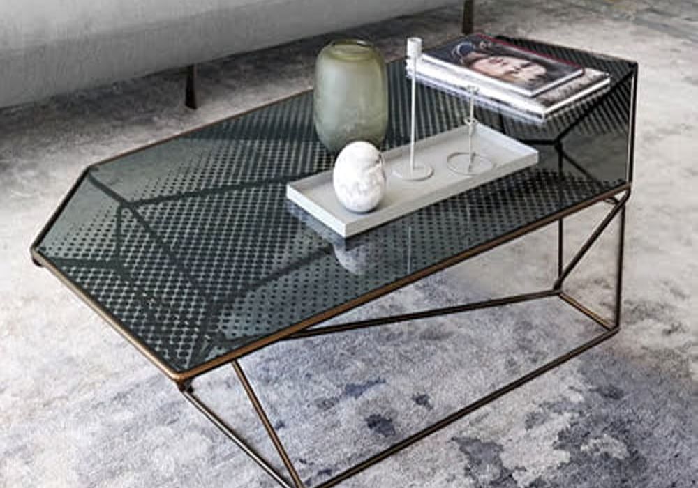 Rebus Coffee Table by Arketipo with bold sculptural base creating dramatic light patterns and pristine glass top