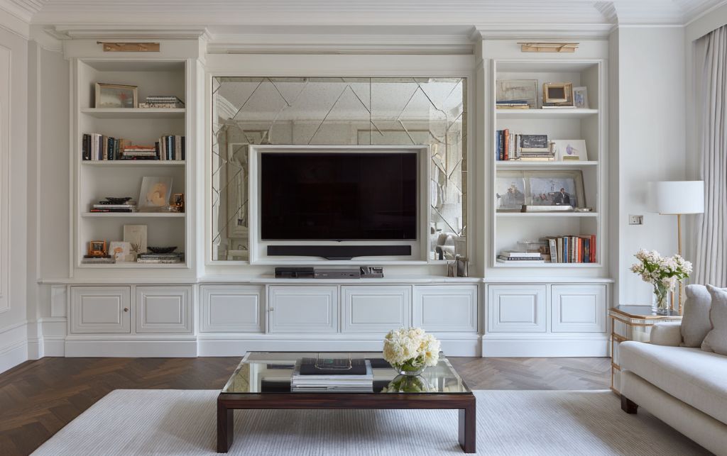 Elegant living space demonstrating visual harmony through concealed storage solutions