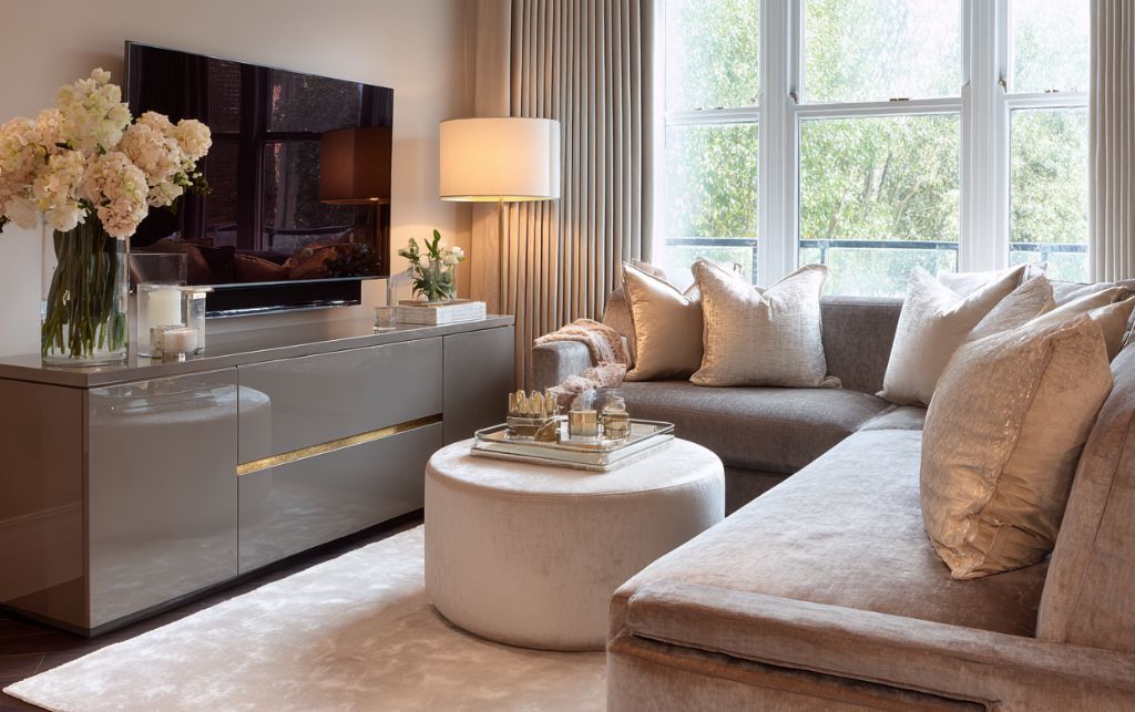 Taupe upholstery complementing grey gloss TV unit